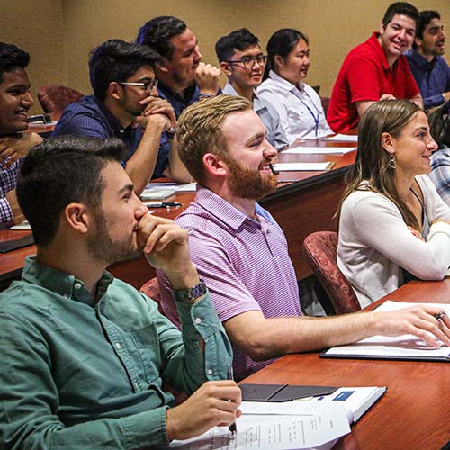 Interns attending orientation meeting