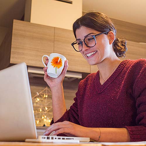 A woman looks at her computer