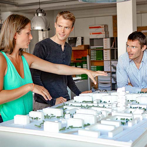 Three employees talk about business