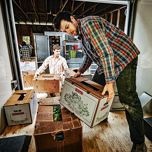 Workers unload a truck