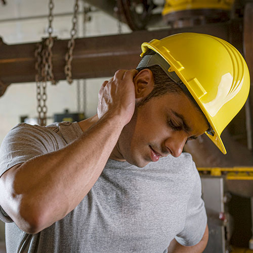 A worker stretches his neck
