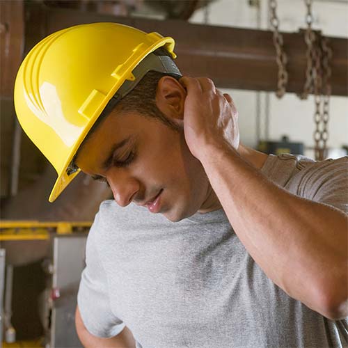 A worker stretches his neck