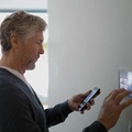 A man sets a smart home system