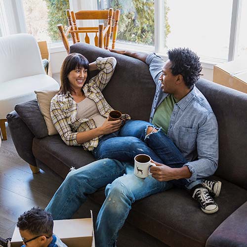 A family relaxes in their new home