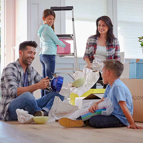A family unpacks boxes