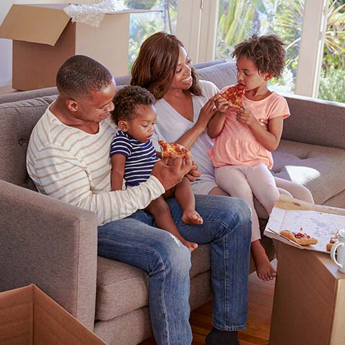 A family unpacks boxes