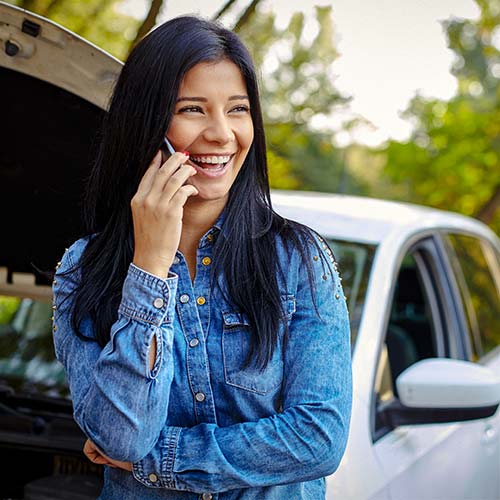 A person and a broken down car