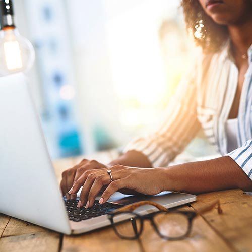 A woman looks at a computer