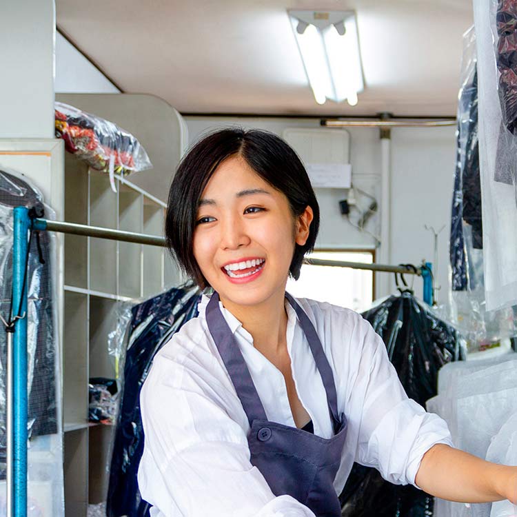 Woman working at dry cleaners